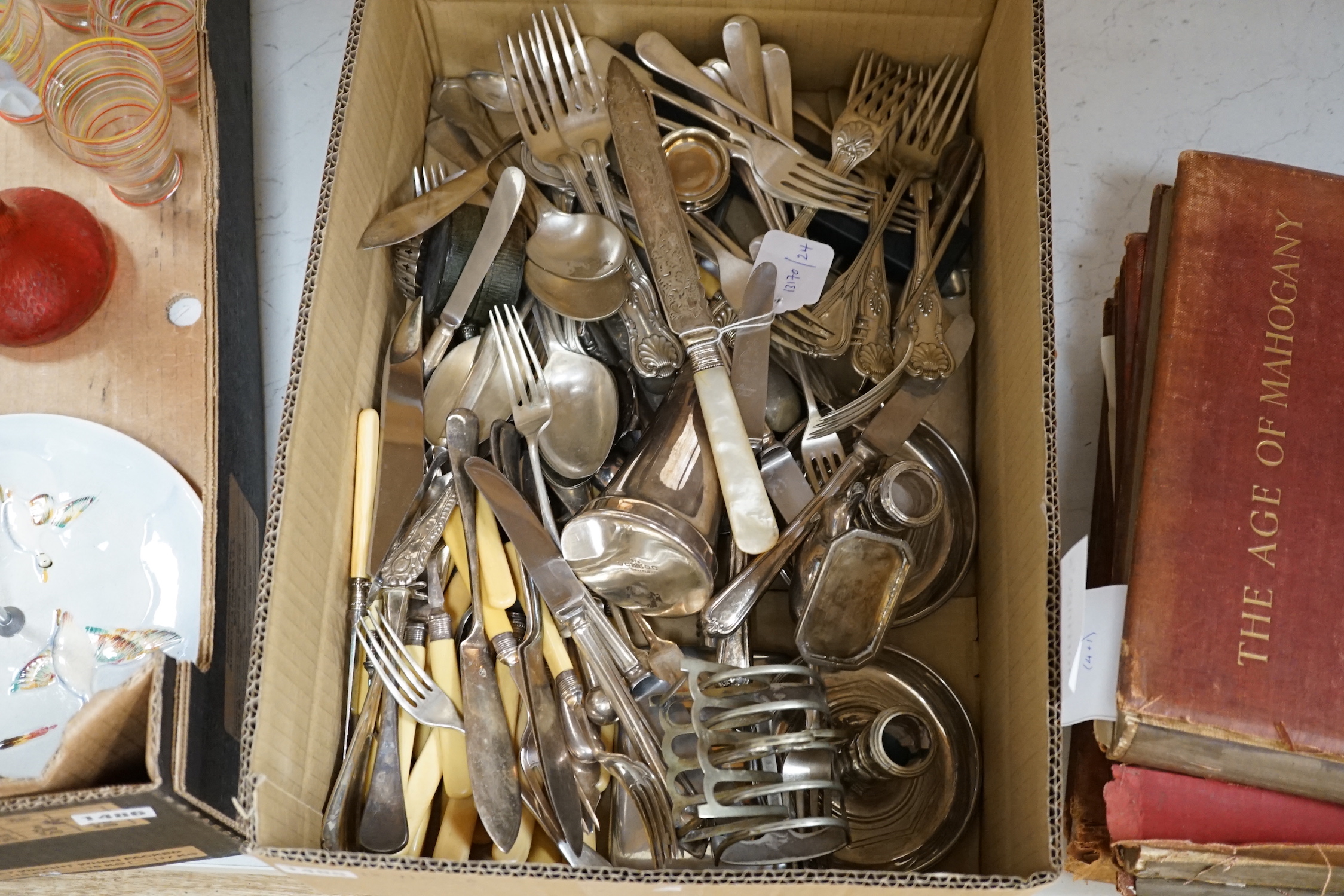 A group of assorted plated flatware